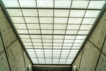 Commercial building interior with slanted roof made of frosted glass panes