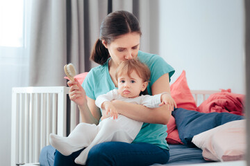 Mom Brushing Daughters Hair on the Side of the Bed