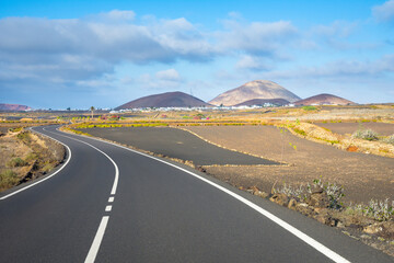 Beautiful view of La Geria vineyards region with Los Volcanes Natural Park in the background, Lanzarote -  Canary Islands, Spain
