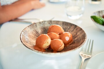 Delicious plate with potatoes and sauce