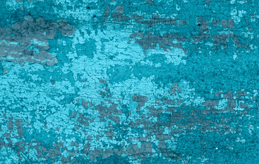 Fototapeta na wymiar Old crackled teal turquoise painted wood surface. Vintage wooden wall or floor with cracked paint.