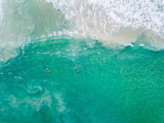 Aerial View Of Wave In Ocean And Surfers. Surfing And Waves