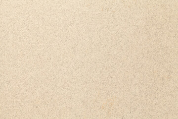 Fototapeta na wymiar Texture of old light beige paper backdrop, closeup. Cream felt background.