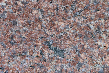 Granite wall for backdrop. Abstract colored pieces. Color - shades of brown and gray.