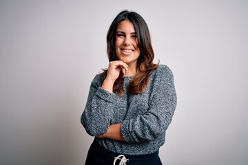 Young beautiful brunette woman smiling happy and confident. Standing with smile on face wearing casual sweater over isolated white background