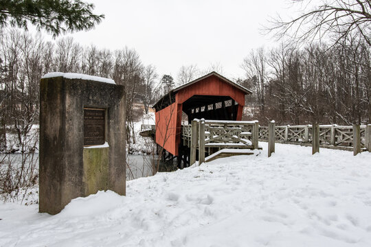 Shaeffer Campbell Covered Bridge and historical marker in the snow