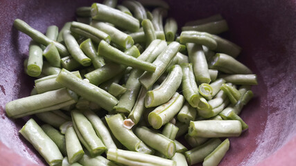 Chopped Green Beans in clay pot.