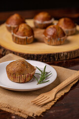 Tasty homemade Banana cake on white plate with rosemary for snack