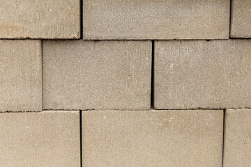 Fototapeta premium cinder blocks stacked high at a construction site