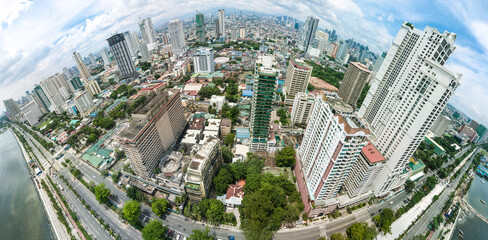 Manila, Philippines - June 2020: Fisheye panoramic aerial of Roxas Boulevard, Manila Skyline and...