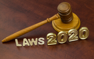 Judge gavel, letters laws and numbers 2020. Concept new laws in year 2020.