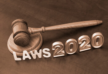 Gavel, letters laws and numbers 2020. Concept new laws in year 2020.