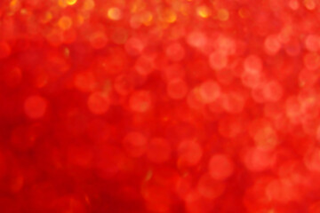 Wallpaper phone shining glitter.Red shiny blurred background. Soft focus.Shining red bokeh...