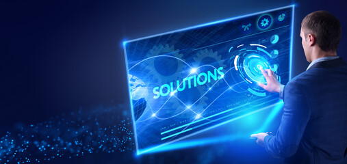 Business, Technology, Internet and network concept. Young businessman working on the tablet of the future, select the virtual screen: Solutions