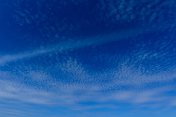 Incredible blue sky with fluffy white clouds. Beautiful cloud patterns, peace and tranquility.