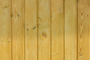 Wooden background, close-up. Light tinted pine clapboard. Materials for construction and finishing works.