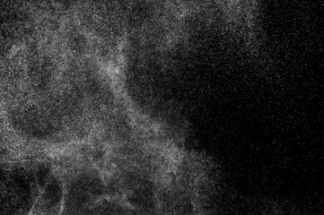 Abstract splashes of water on black background. Freeze motion of white particles. Rain, snow overlay texture.