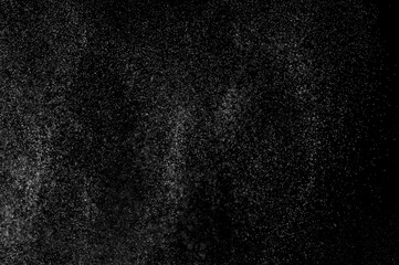 Fototapeta premium Abstract splashes of water on black background. Freeze motion of white particles. Rain, snow overlay texture.