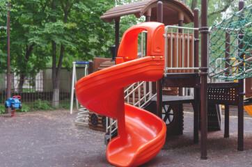 Playground in the courtyard of a residential building, children's attractions, leisure, child development and health.