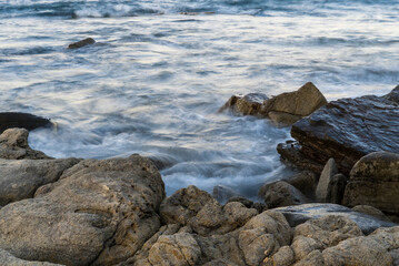rocks in the rushing sea