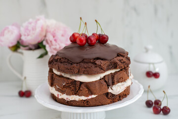 Obraz na płótnie Canvas black forest chocolate cake with cherry pie filling with dark chocolate glaze