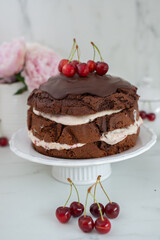 black forest chocolate cake with cherry pie filling with dark chocolate glaze