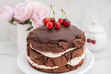 Obraz na płótnie Canvas black forest chocolate cake with cherry pie filling with dark chocolate glaze