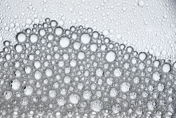 Beautiful bubbles from mixing water, oil and soap. Macro photography. Colorful bubbles. Abstract background. 