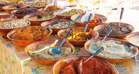 counter with olives and olive oil on the market.