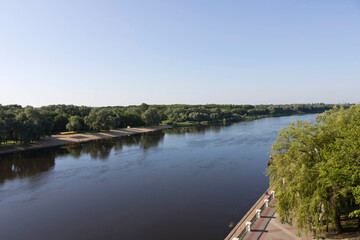 View of the river from the bridge. Panoramic view of the river and embankment.
