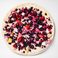 sweet pizza with berries on the white