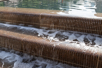 Water flowing in the man made waterfall.