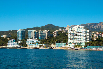 Fototapeta na wymiar view of hotels and residential buildings from the Black Sea side in Yalta. Crimea