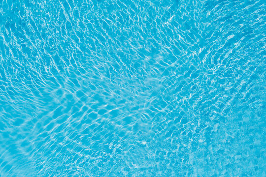 Beautiful refreshing blue swimming pool water, view from above
