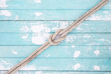 pattern rope on a blue old wooden background. Top view. Leave a copy space for writing descriptive...