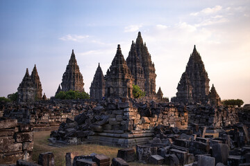 Ruins of Pramanan temple, hindu complex at sunset time. Warm light. No people on the picture. Stones laying on the floor. Prambanan, Yogyakarta, Java, Indonesia, Southest Asia