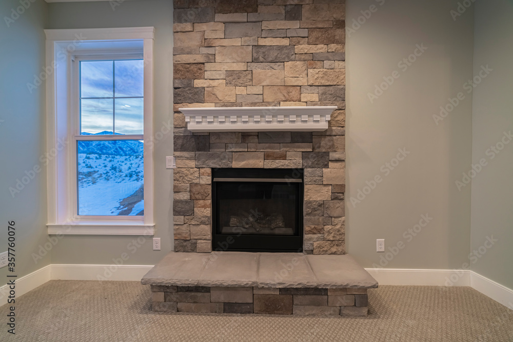 Wall mural Fire insert in a feature stone brick wall