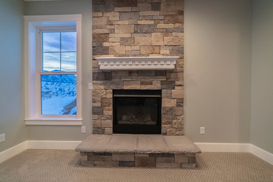 Fire insert in a feature stone brick wall