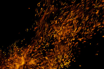 flame of fire with sparks on a black background