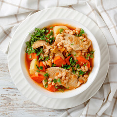 white bean, vegetables pork stew in a bowl