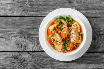 white bean, vegetables pork stew in a bowl