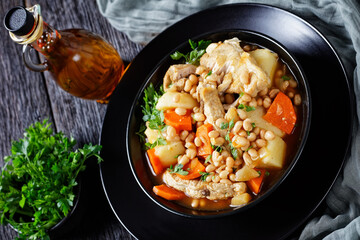 a portion of bean, vegetables and pork stew