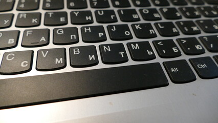 laptop keyboard with Latin and Cyrillic alphabet