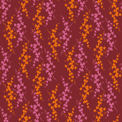 Orange and pink ivy leaves seamless vector pattern on burgundy red background. Decorative vibrant surface print design for summertime and autumn fabric, textile, stationery, sccrapbook, and packaging.