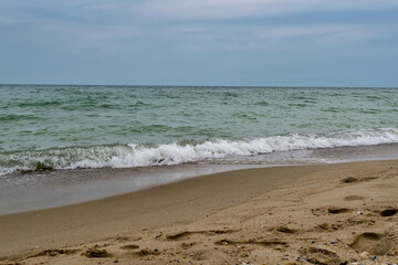 Sea view from tropical beach with sunny sky.