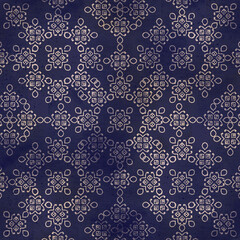 Vintage decorative embroidery pattern from egypt on blue textured background