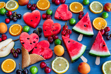 Various of ice cream cones to the table with fresh fruits