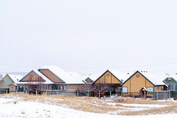 Residential community on a frosty landscape covered with snow in winter