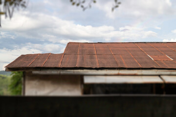 Vintage house roof with cloudy sky