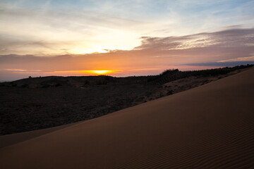 Fototapeta na wymiar Sunset at Sand dunes in the desert, Muine, Vietnam